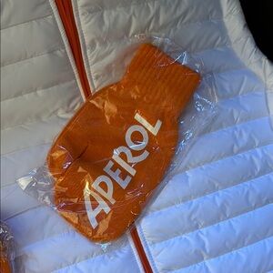 Aperol Orange Mittens and White Puffer Jacket